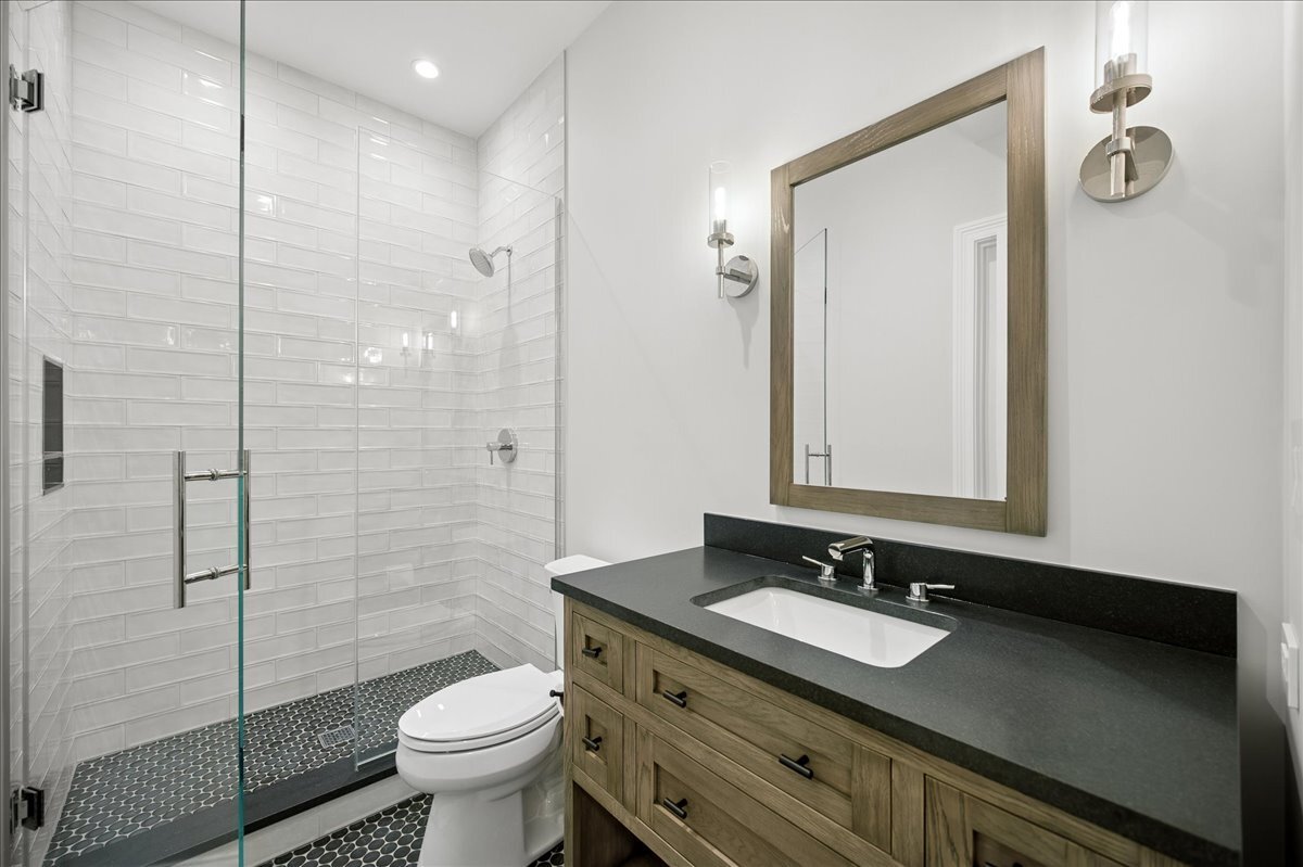 525 Ash Street Winnetka, IL 60093 - Photo 54 of 56 a bathroom with a granite countertop sink toilet and shower