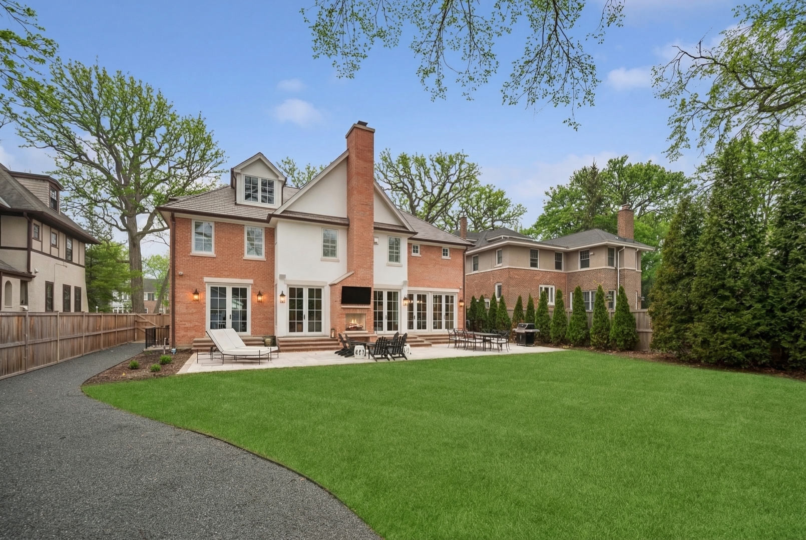 525 Ash Street Winnetka, IL 60093 - Photo 56 of 56 a front view of a house with a garden and trees