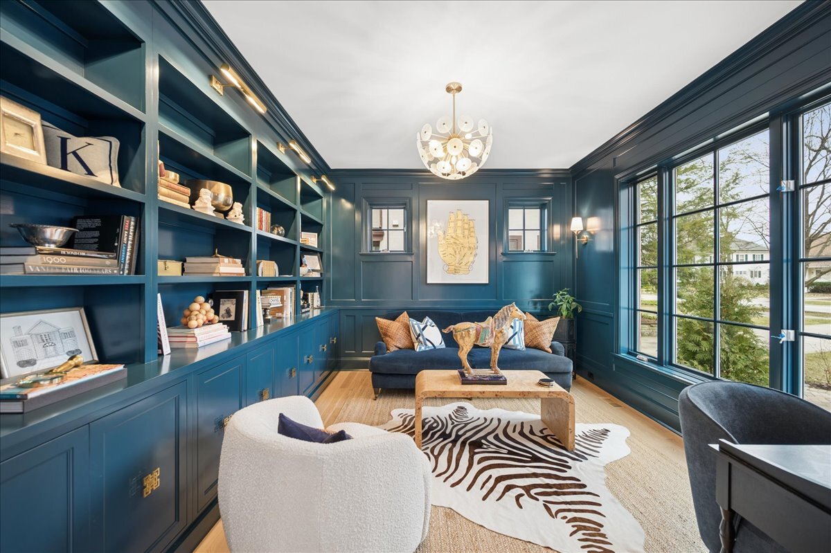525 Ash Street Winnetka, IL 60093 - Photo 6 of 56 a living room with furniture a bookshelf and a large window