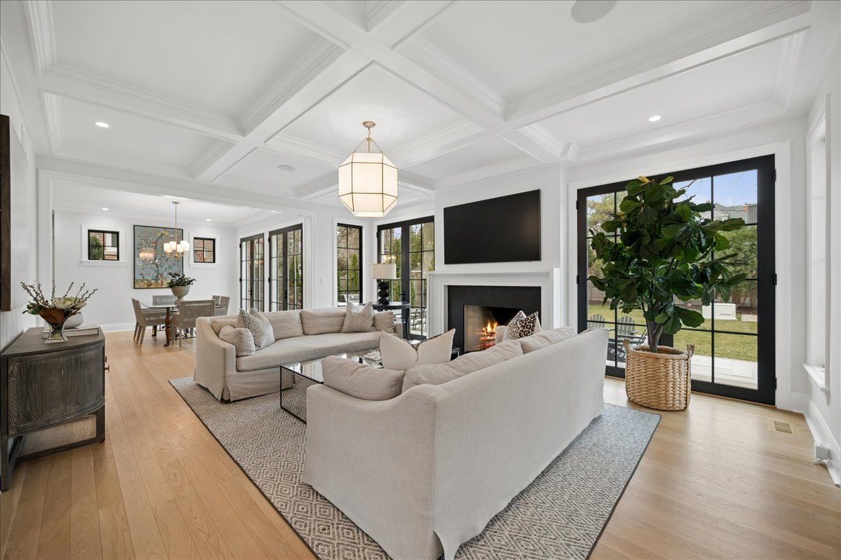 525 Ash Street Winnetka, IL 60093 - Photo 7 of 56 a living room with furniture a fireplace and a floor to ceiling window