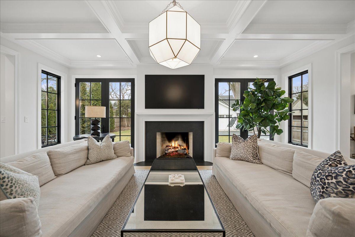 525 Ash Street Winnetka, IL 60093 - Photo 9 of 56 a living room with furniture a window and a fireplace