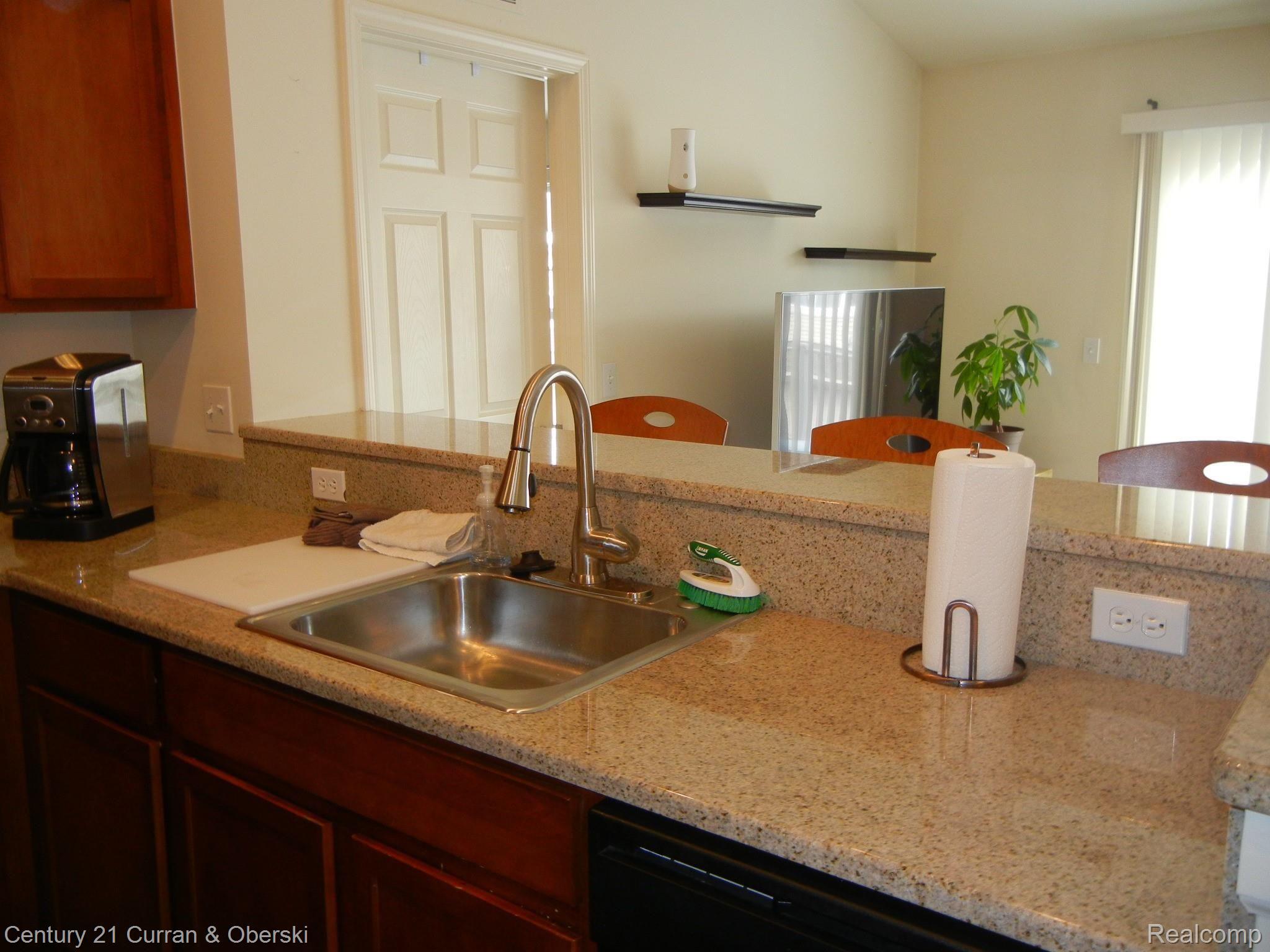 270 North Wixom Road, Unit 60 Wixom, MI 48393 - Photo 12 of 26 Granite counters in Kitchen