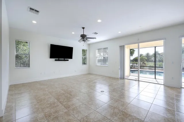 a view of livingroom with workspace and a flat screen tv