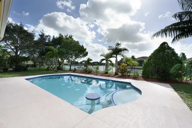 a view of swimming pool with a yard
