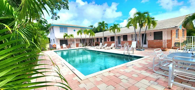swimming pool view with a seating space