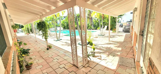 a view of a bathroom with a large window and the shower