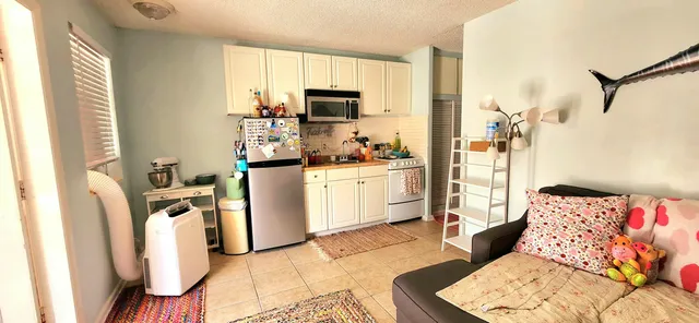 a bedroom with furniture and a dresser