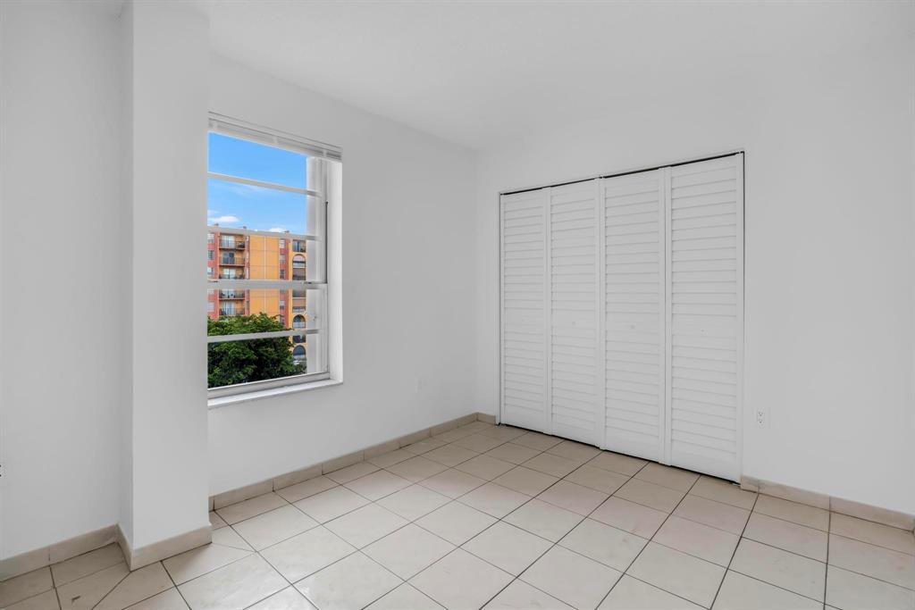 4801 Northwest 7th Street, Unit 50316 Miami, FL 33126 - Photo 11 of 31 an empty room with windows