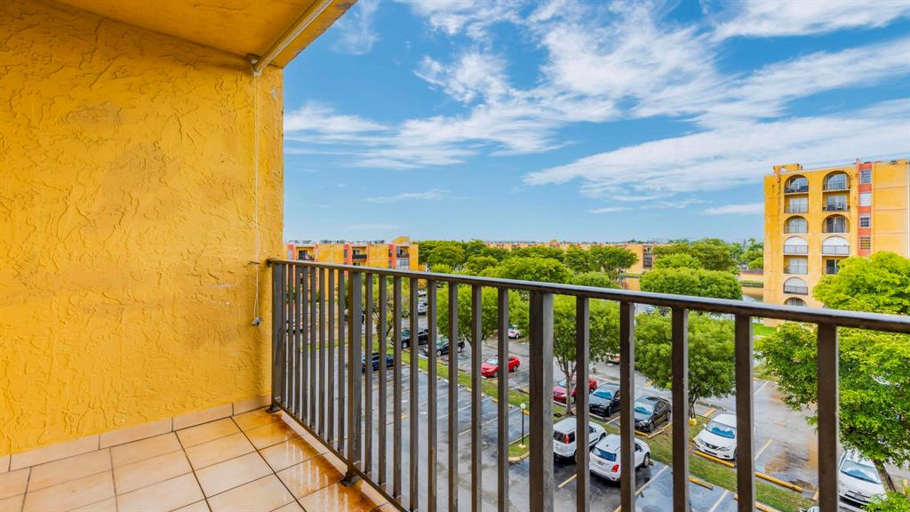 4801 Northwest 7th Street, Unit 50316 Miami, FL 33126 - Photo 19 of 31 a view of a balcony with an outdoor space