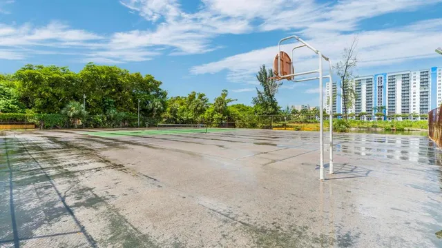 a hallway with sliding door and chandelier