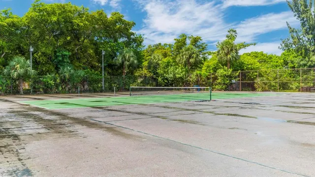 a view of swimming pool with a lawn chairs