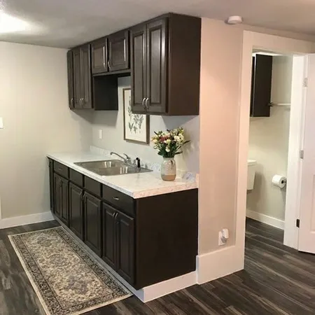a kitchen with a sink and cabinets