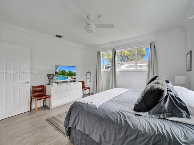 a bedroom with a bed and a desk