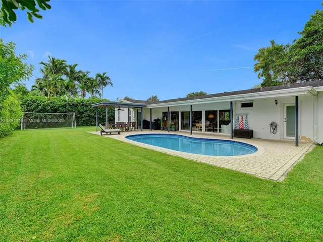 a view of a house with a swimming pool