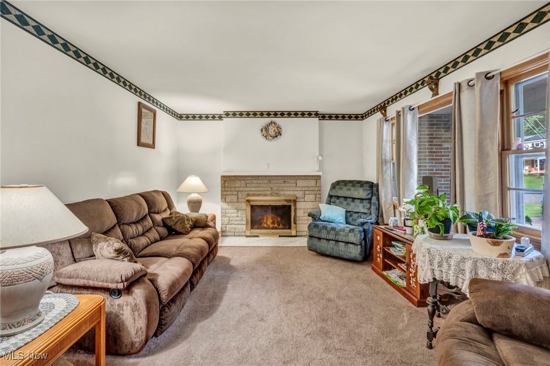 3524 Oak Road Stow, OH 44224 - Photo 3 of 19 Living room featuring a fireplace and carpet
