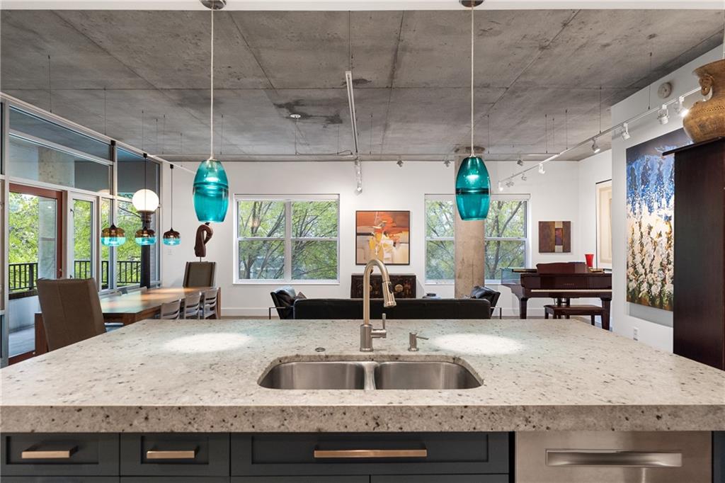 845 Spring Street Northwest, Unit 129 Atlanta, GA 30308 - Photo 19 of 48 a kitchen with a sink and large window