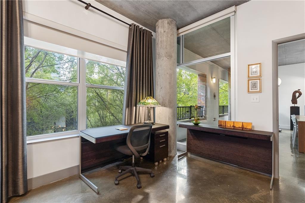 845 Spring Street Northwest, Unit 129 Atlanta, GA 30308 - Photo 24 of 48 a view of a workspace with furniture and a window