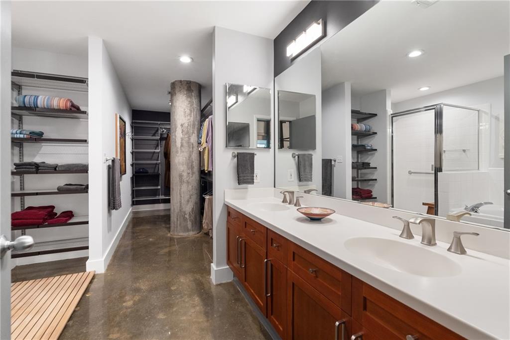 845 Spring Street Northwest, Unit 129 Atlanta, GA 30308 - Photo 26 of 48 a bathroom with a sink double vanity and a shower
