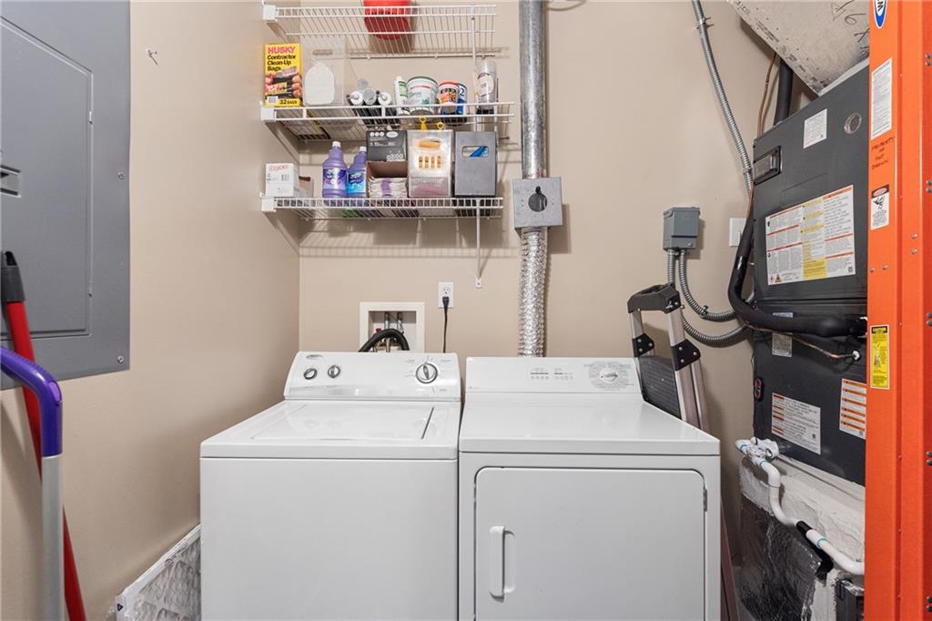 845 Spring Street Northwest, Unit 129 Atlanta, GA 30308 - Photo 30 of 48 a utility room with dryer and washer