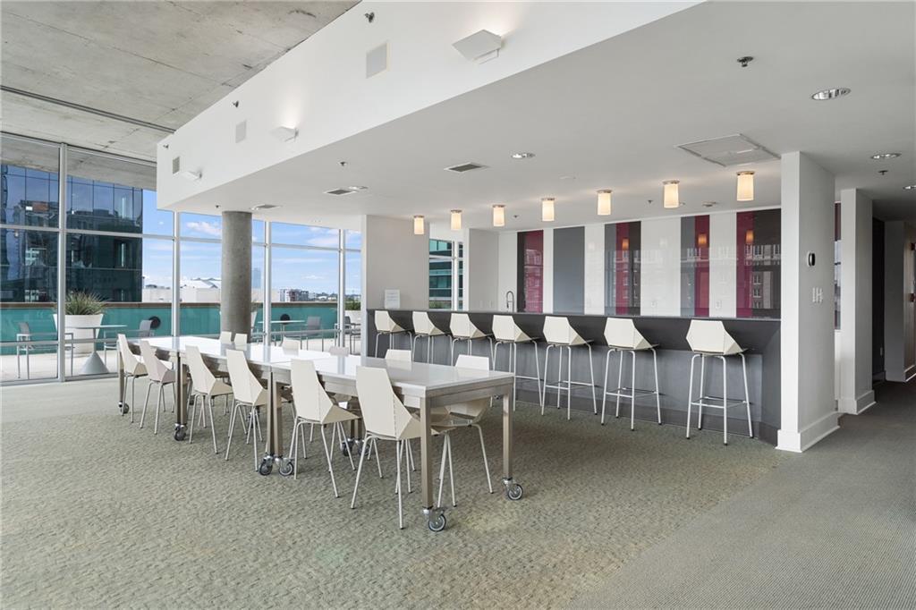 845 Spring Street Northwest, Unit 129 Atlanta, GA 30308 - Photo 43 of 48 a group of people sitting at tables in a room