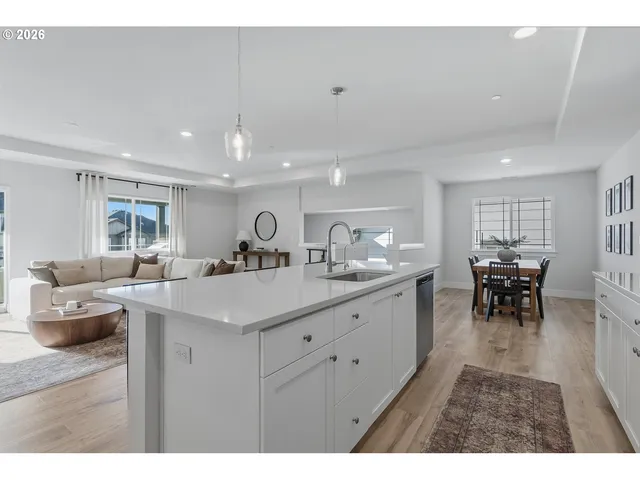a kitchen with furniture and a dining table