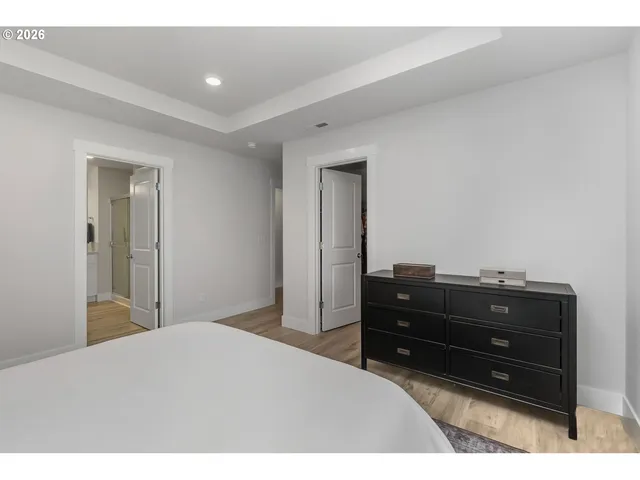 a bedroom with a bed and a dresser