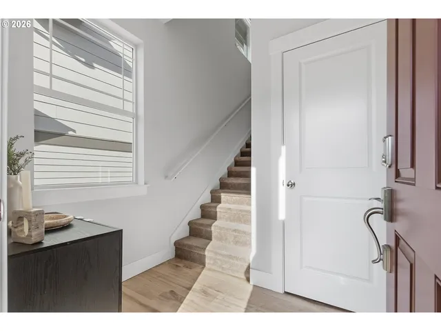 a view of entryway with wooden floor