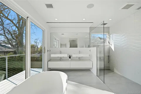 a en suite bathroom with a large mirror and shower