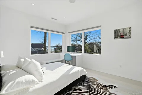 a bed room with a bed and a window