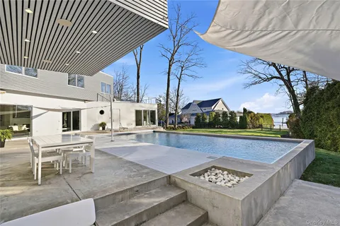 a view of outdoor kitchen with seating area