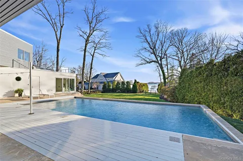 a view of a house with yard and sitting area
