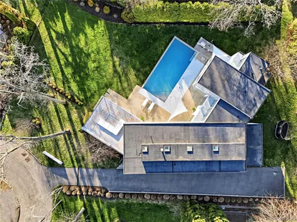 a view of house with a yard