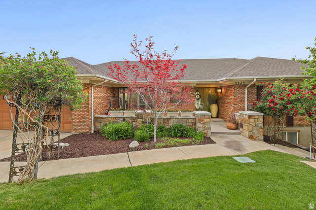 2342 Charros Road Sandy, UT 84092 - Photo 87 of 94 Brick and stone facade residence featuring an asphalt shingle roof