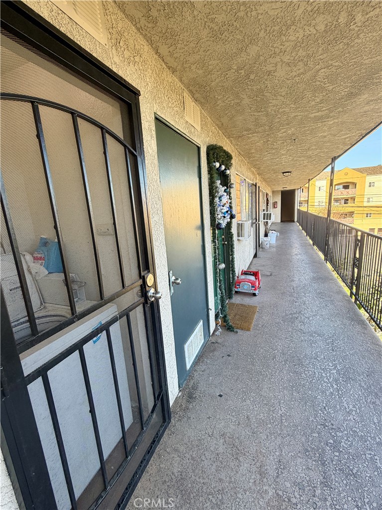 710 West Washington Avenue Santa Ana, CA 92706 - Photo 8 of 10 a view of a porch with wooden floor and stairs