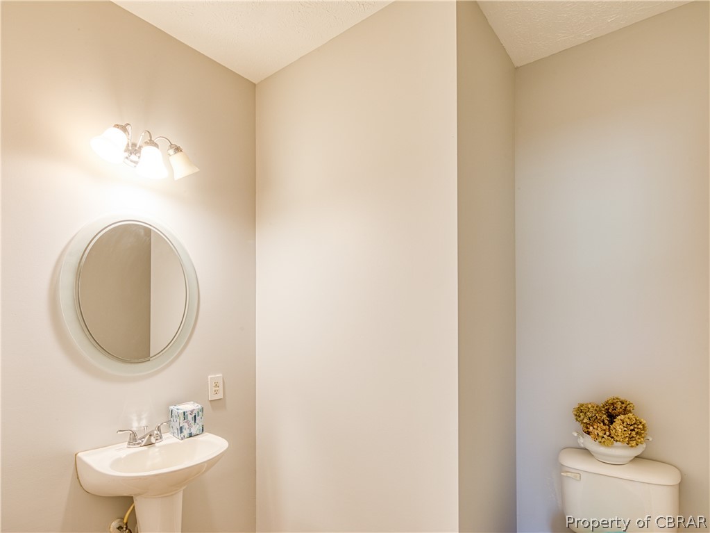 921 Buckley Hall Road Dutton, VA 23050 - Photo 20 of 42 a bathroom with a sink and a mirror