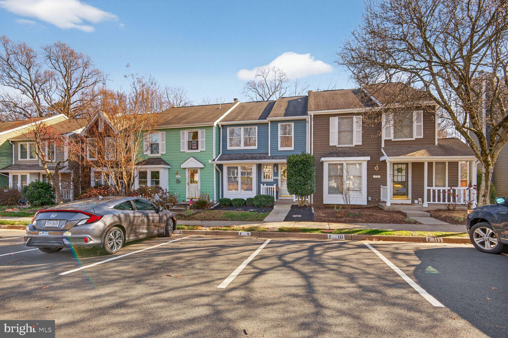 1548 Poplar Grove Drive Reston, VA 20194 - Photo 3 of 10 a city street lined with buildings and cars