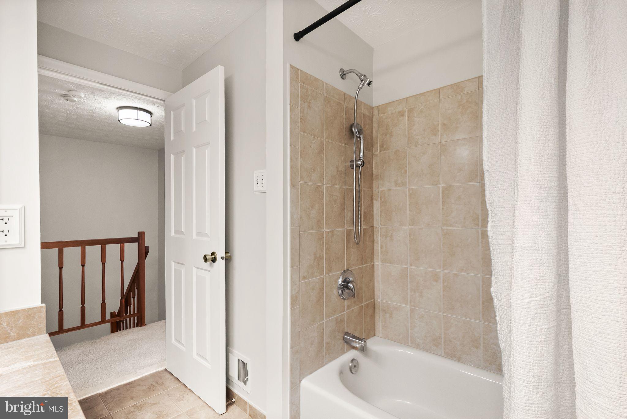 1548 Poplar Grove Drive Reston, VA 20194 - Photo 36 of 55 Tiled shower surround