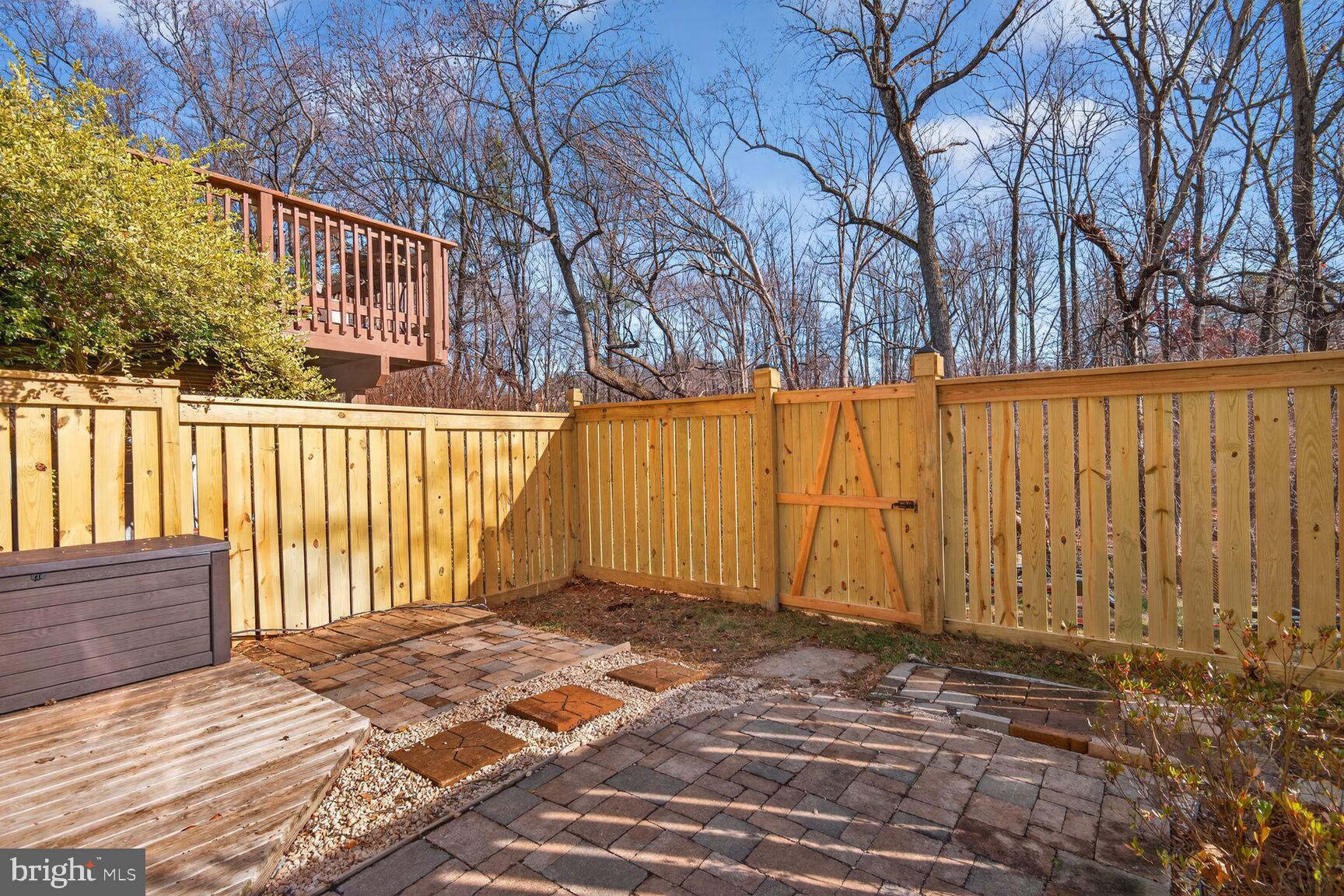 1548 Poplar Grove Drive Reston, VA 20194 - Photo 7 of 10 a view of a house with a wooden fence