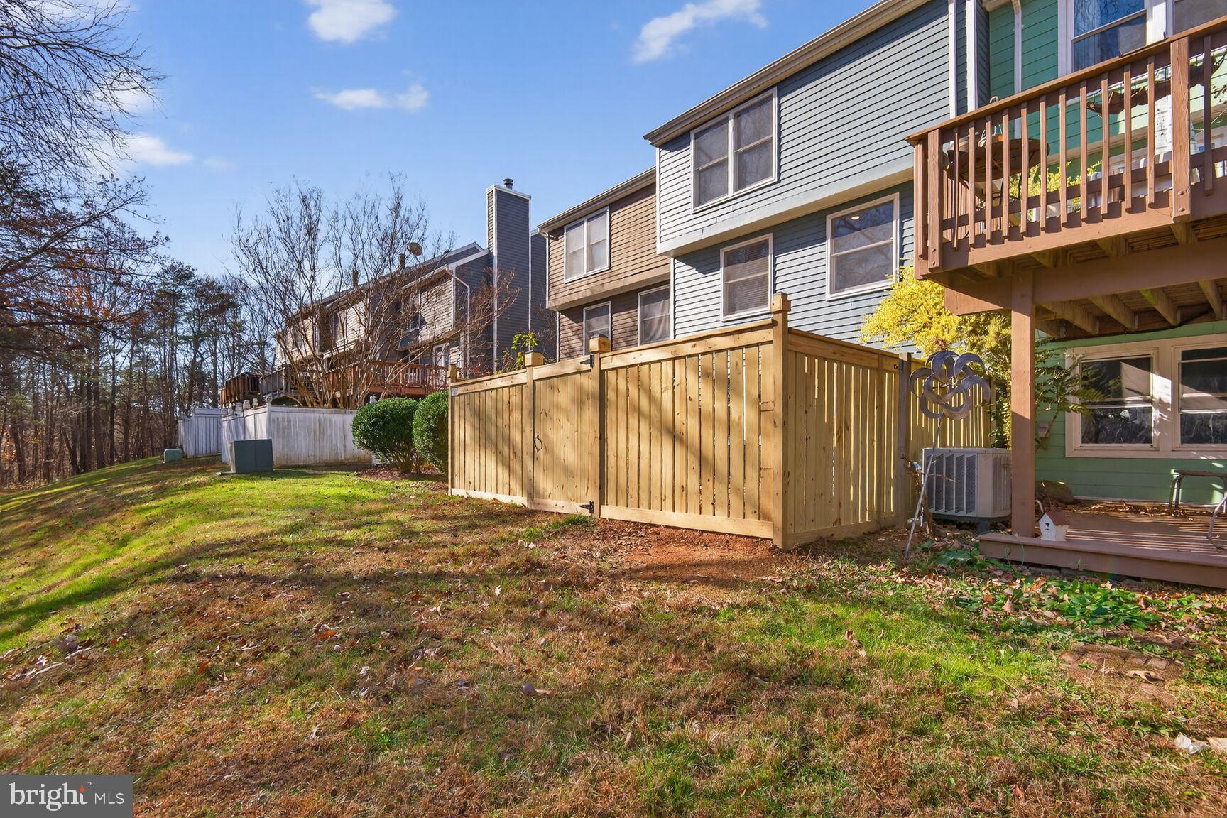 1548 Poplar Grove Drive Reston, VA 20194 - Photo 9 of 10 a view of a house with a yard