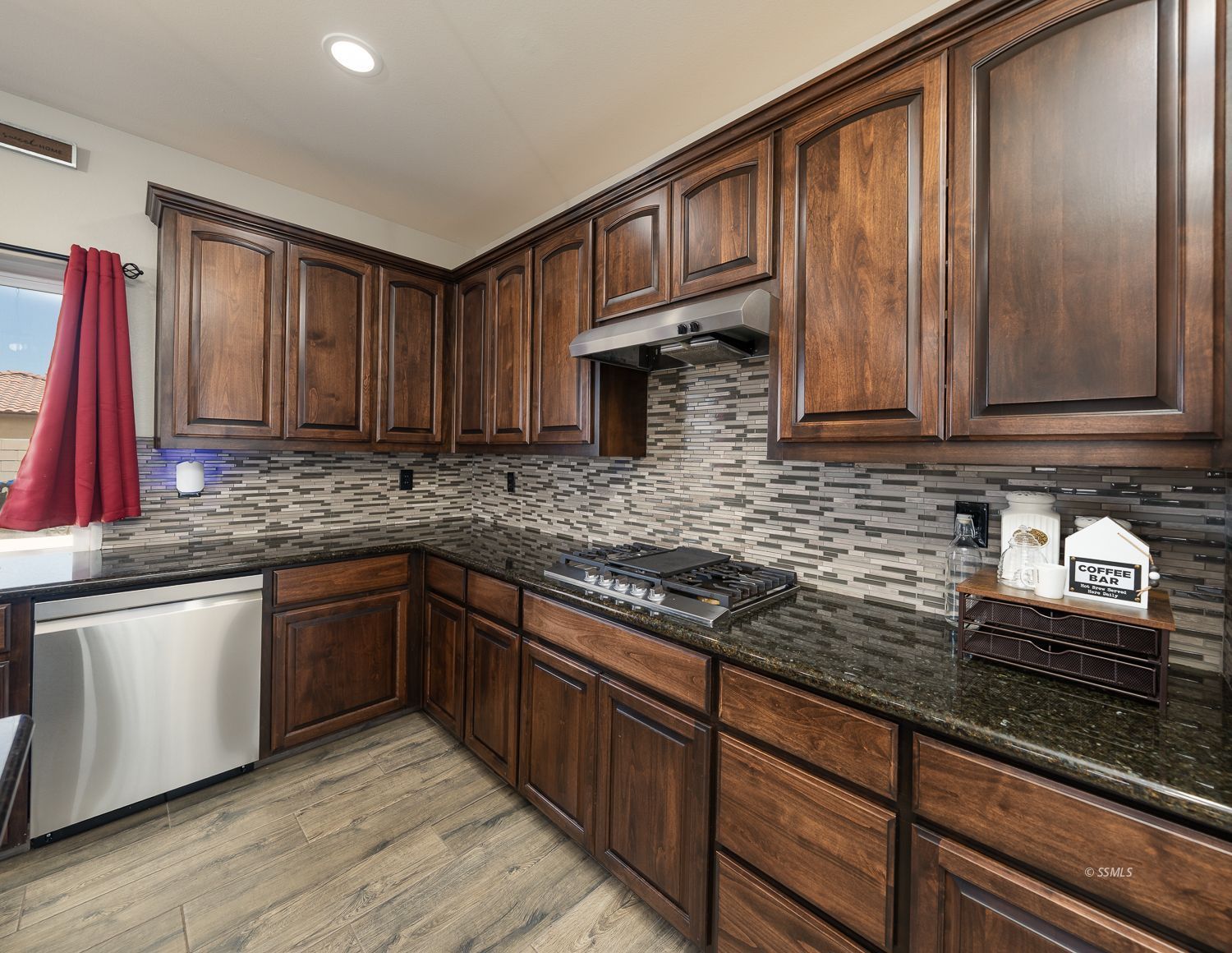 133 Rancho Del Cerro Ridgecrest, CA 93555 - Photo 14 of 50 a kitchen with stainless steel appliances granite countertop a sink stove and cabinets