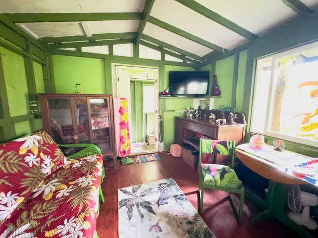 a living room filled with furniture and a table