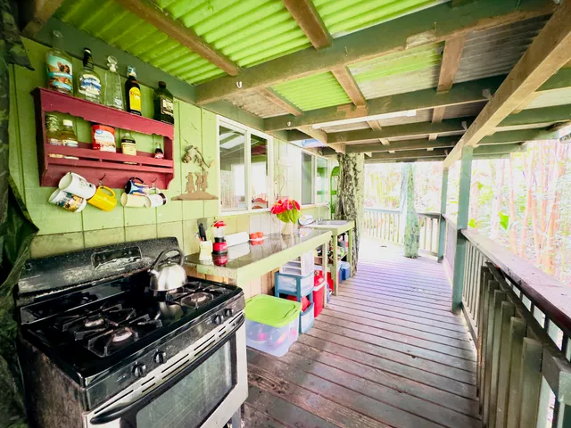 a kitchen with stainless steel appliances granite countertop a stove and wooden floor