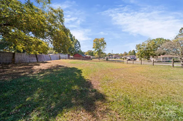 a view of a lake with houses in the back