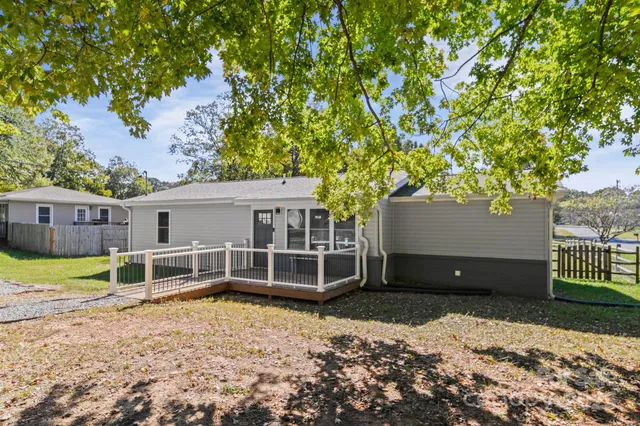 a house with trees in the background