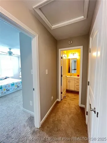 a bedroom with two beds and a chandelier