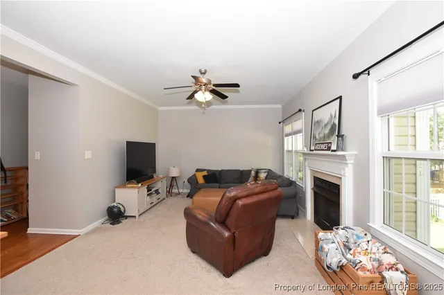 a bedroom with a bed chandelier and a window
