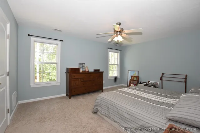 a bed room with a bed and a chandelier