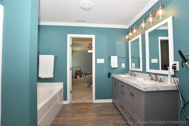 a bathroom with a granite countertop sink a toilet and a mirror