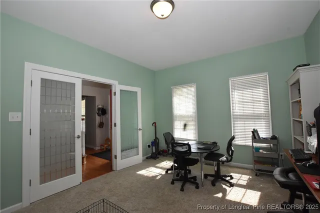 a room with furniture and gym equipment