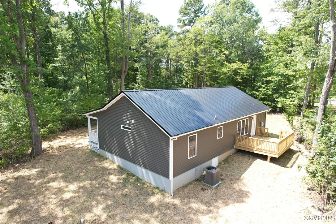 4875 Farmville Road Farmville, VA 23901 - Photo 3 of 13 View of home's exterior featuring a wooden deck an